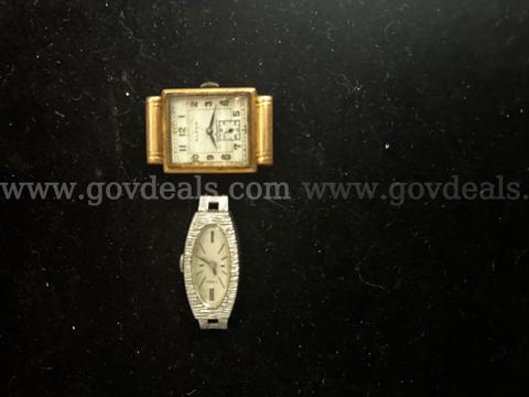 TWO VINTAGE WATCHES WITH NO WATCH BAND, (1) ALTON GOLD IN COLOR TANK STYLE, (1) TIMEX SILVER IN COLOR