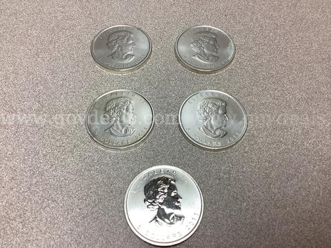 5 Troy ounces of 999.9 Fine Silver ( 8 Dollar coins )