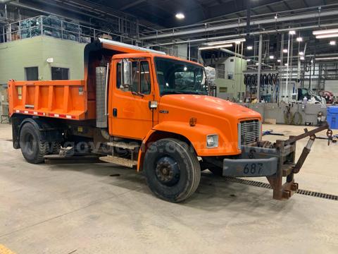 2004 Freightliner FL80 Dump truck with underbody scraper.