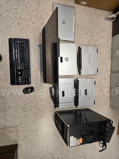 Group of computers, laptops and assocaited items