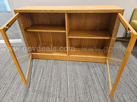 Wooden Cabinet with bifold doors. Glass windows on doors