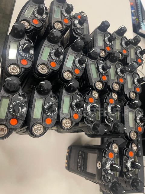 10 Portable Radios with accompanying antenna, charger base station, and wire. Batch 2