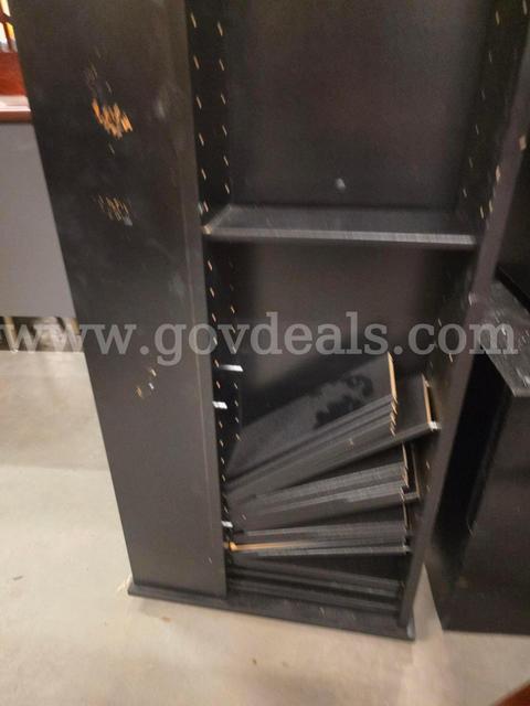 Rotating display rack with shelves