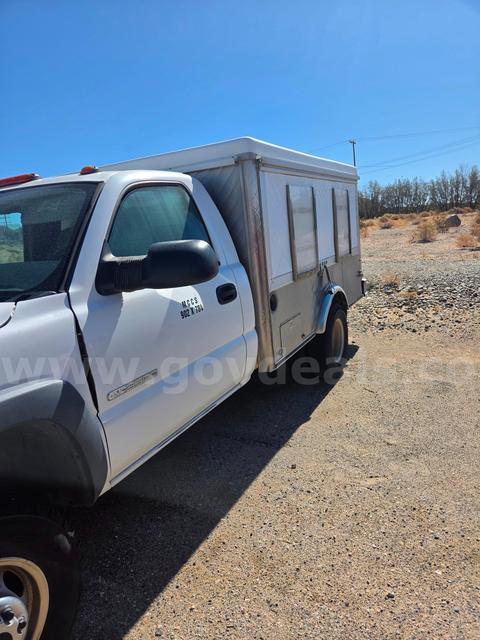 White 2004 GMC Sierra 3500 pickup with attached Catering Bed