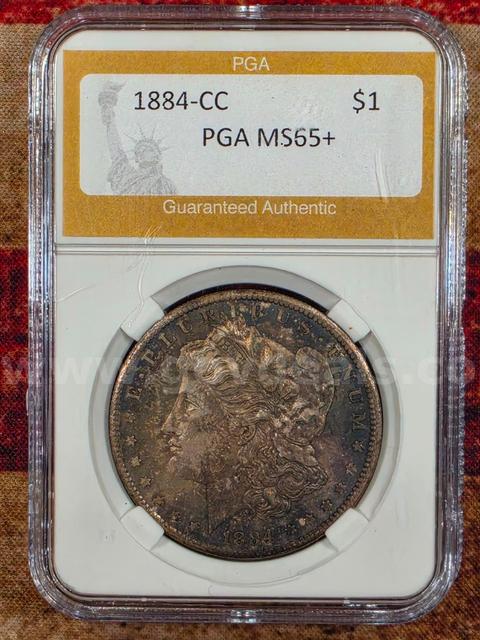 Stunning 1884-CC Morgan Silver Dollar PGA Graded MS 65+