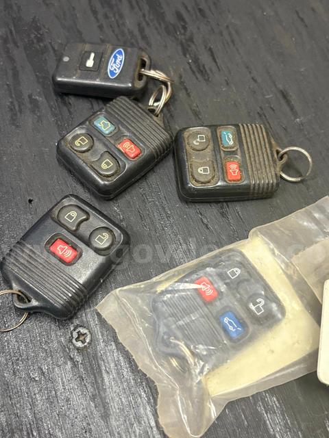 LOT OF NEW AND USED FORD REMOTES - SHIPPING ONLY - MA