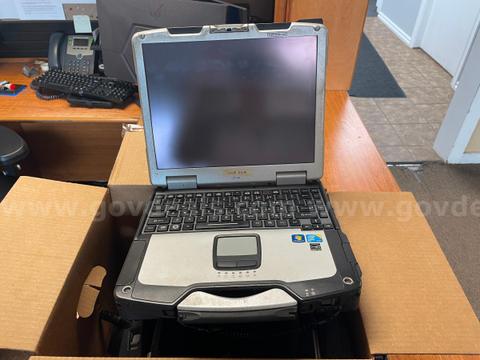 Three laptops and a tablet mount