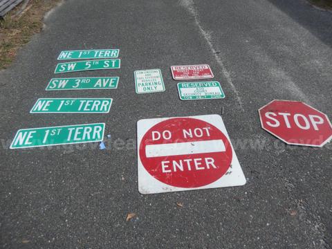 USED (5) STREET SIGNS, (1) DO NOT ENTER SIGN, (1) STOP SIGN, (1) FUEL EFFICIENT VEHICLES PARKING SIGN