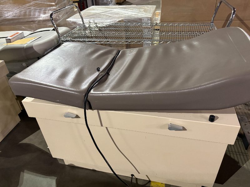 EXAM AND TREATMENT TABLE — photo 1