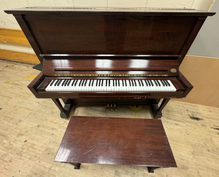 Steinway and Sons upright piano with stool