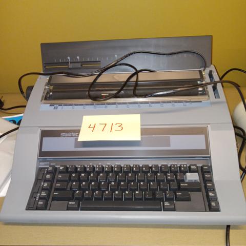 Swintech typewriter and two swing fine hole punchers