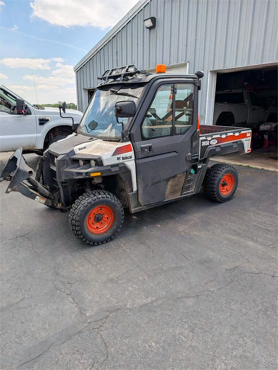 Bobcat Utility Vehicle with Front Blade and Power Broom — photo 1