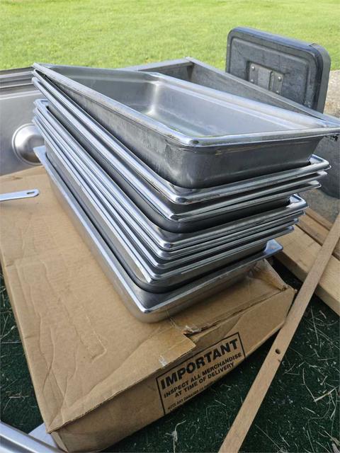 11 full-size steam table trays and some full and half covers