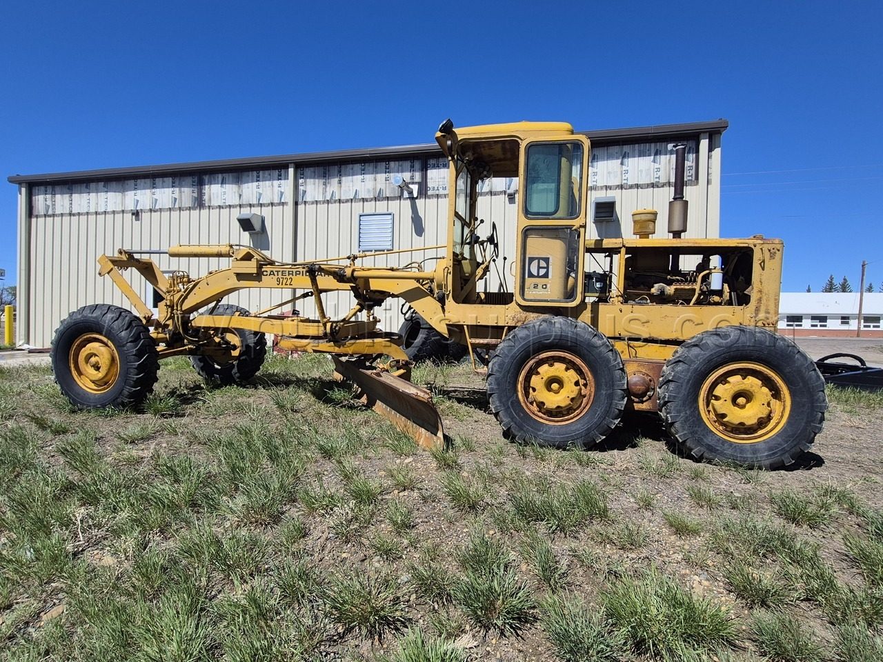 1969 Cat 120 Road Grader, a US government surplus lot with no bids, in Rock River, WY