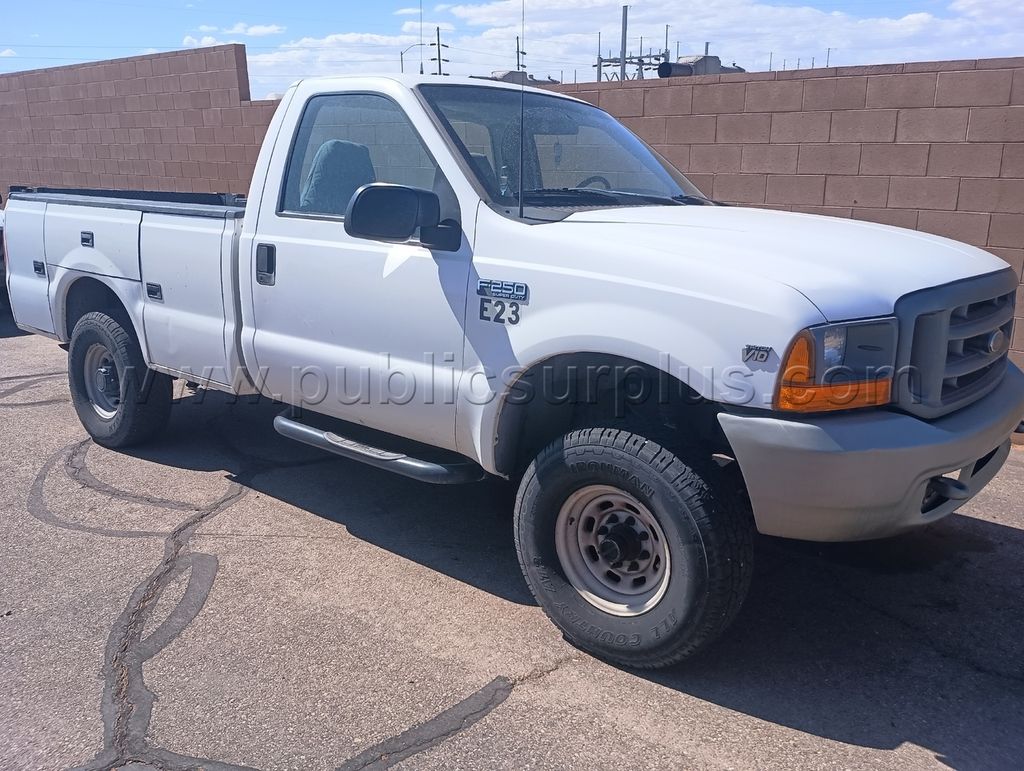 E23 1999 Ford F250 4x4 6.8L V10 — photo 1