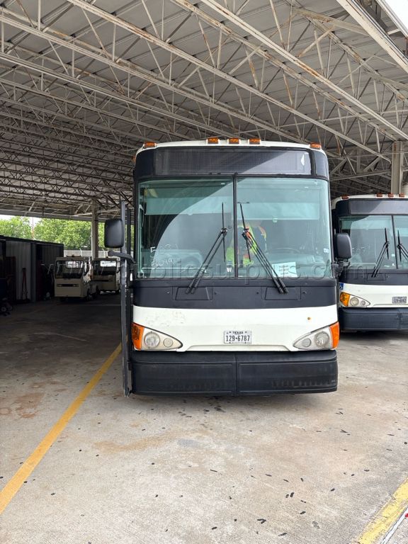 2009 MCI HYBRID/ELECTRIC BUS (UNIT 5099) — photo 1