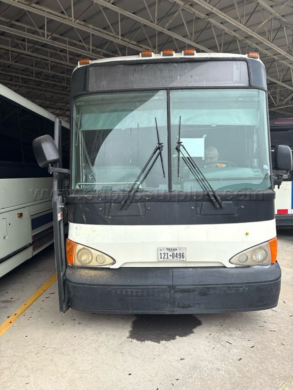 2009 MCI HYBRID/ELECTRIC BUS (UNIT 5039) — photo 1