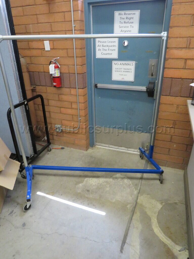 Rolling Clothing Rack **Unknown Condition** - photo 1